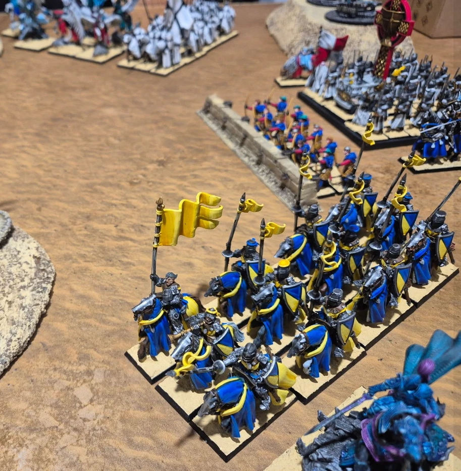 Knight cavalry in blue and yellow livery