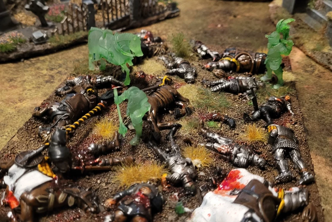 Battlefield of fallen knights with ghosts
